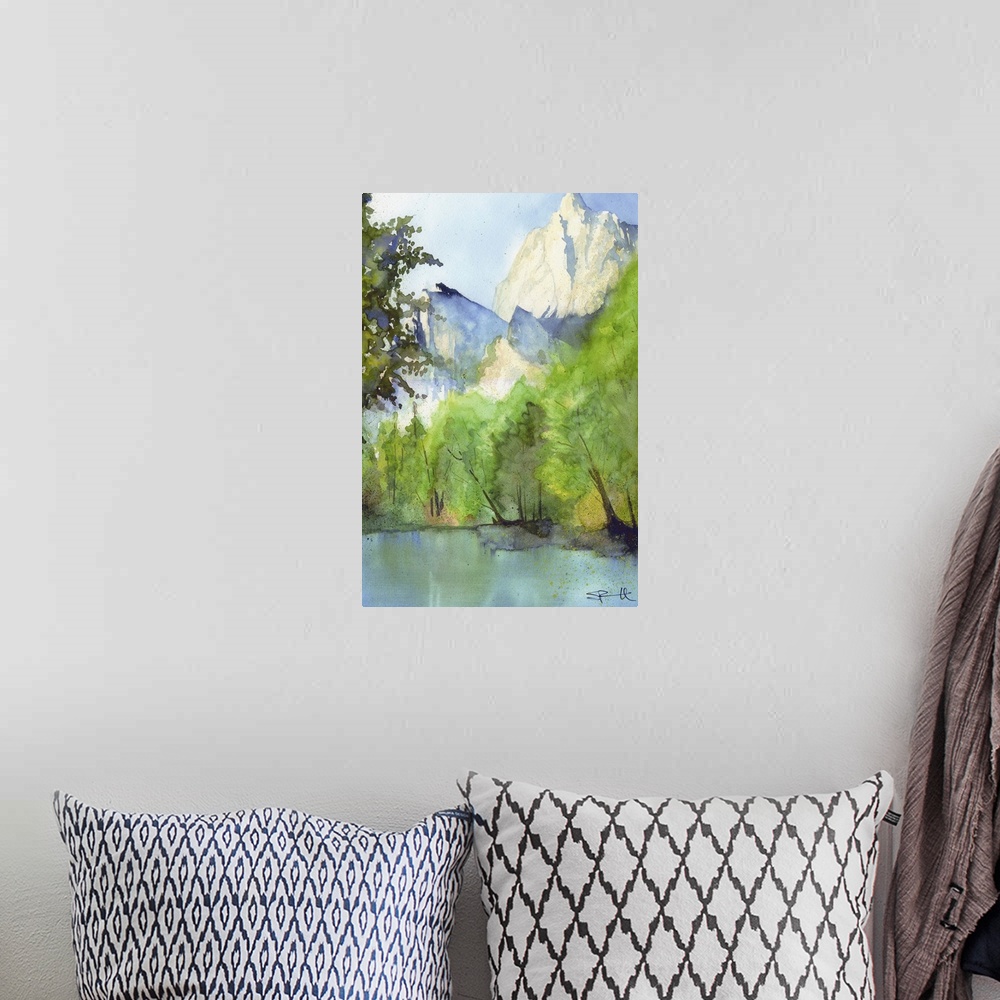 A bohemian room featuring Landscape painting of a river in a forest with tall mountains.
