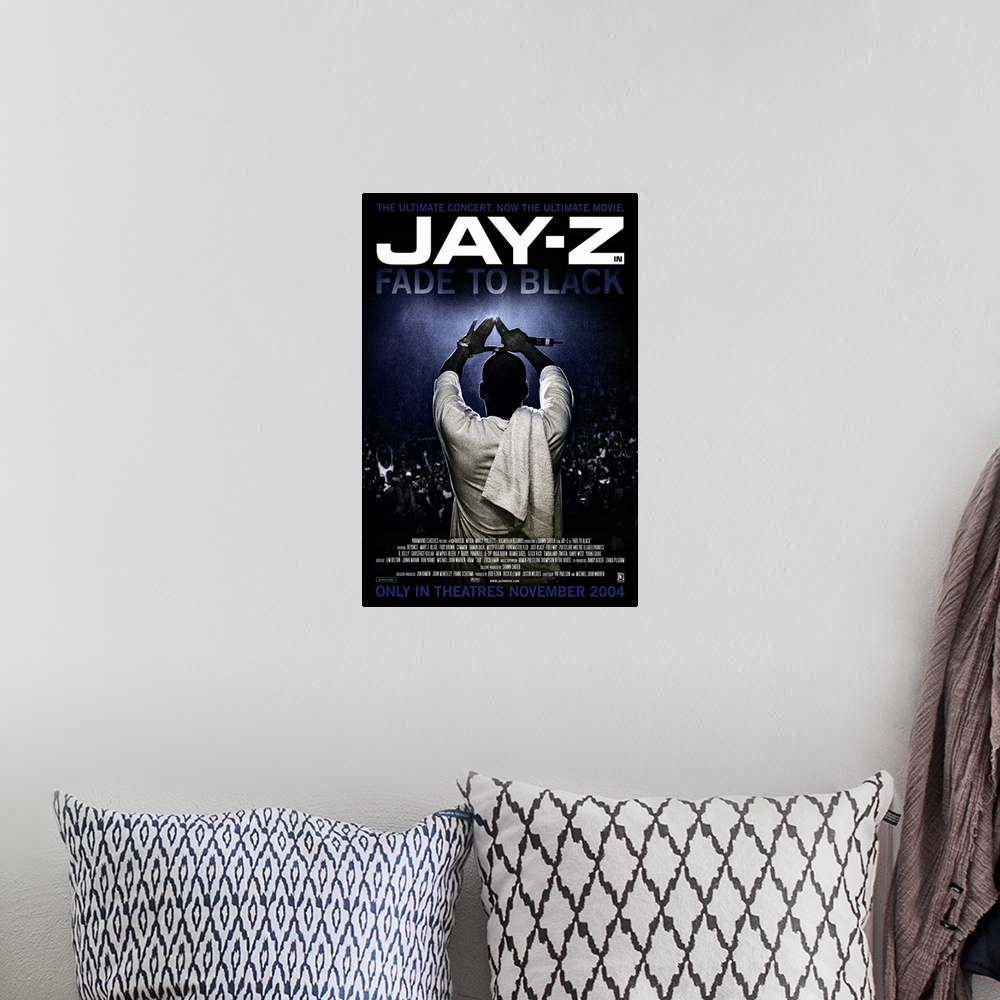 A bohemian room featuring Vertical movie advertisement for the 2004 film, Fade to Black, starring Jay-Z.  Jay-Z stands faci...