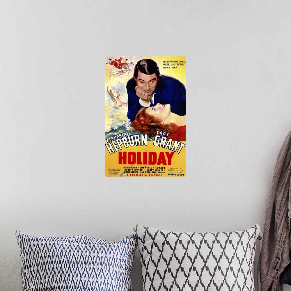 A bohemian room featuring Poster for the classic movie "Holiday" debuting in 1938. It shows the female lead laying her head...