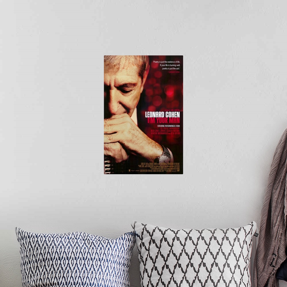 A bohemian room featuring Poster for the movie titled "Leonard Cohen I'm Your Man". It shows a man with both his hands fold...