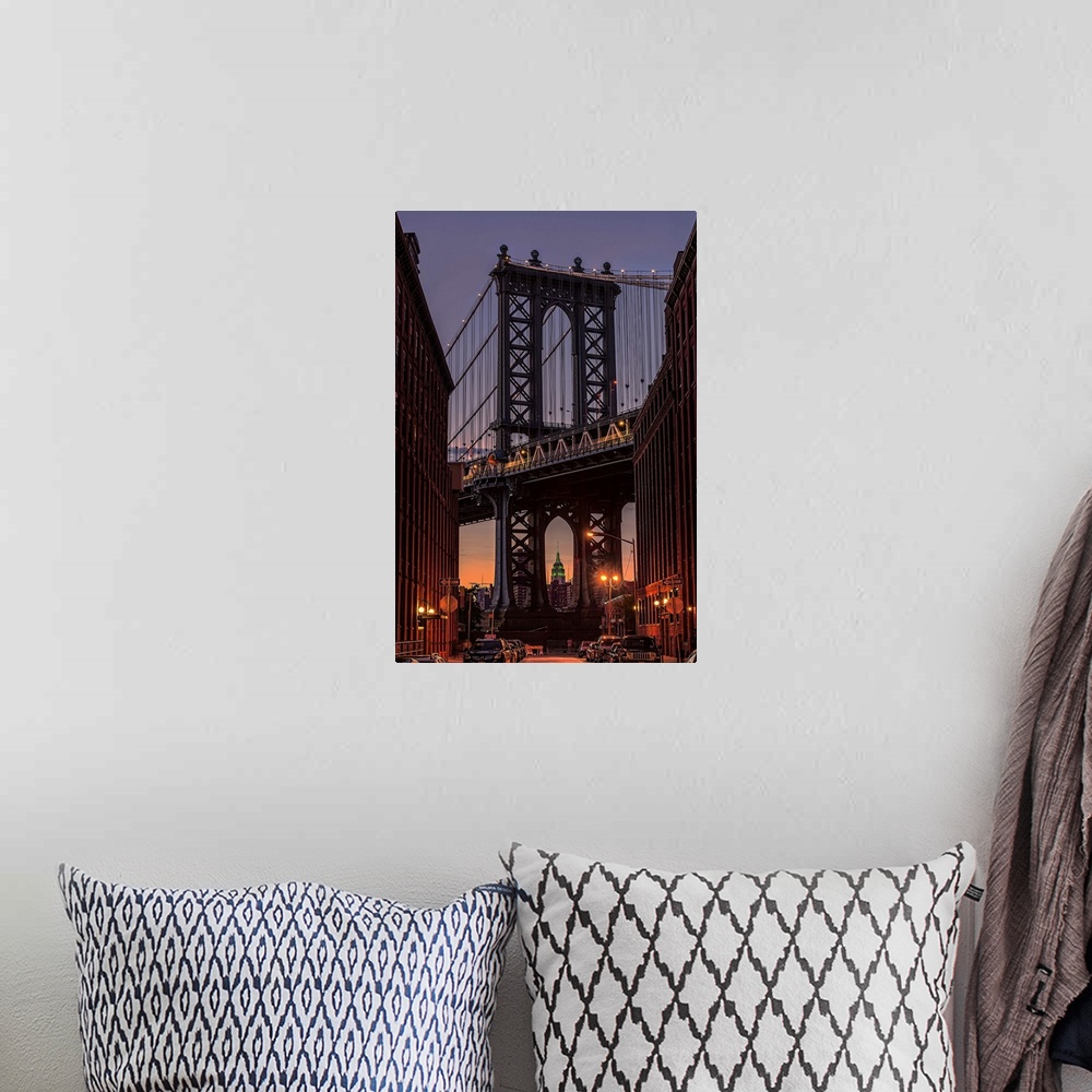 A bohemian room featuring A photograph of the Manhattan bridge at twilight.