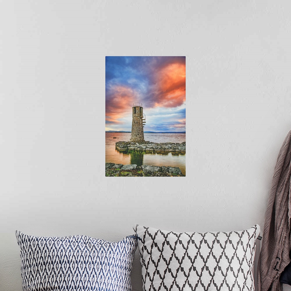 A bohemian room featuring Sunset over an old lighthouse
