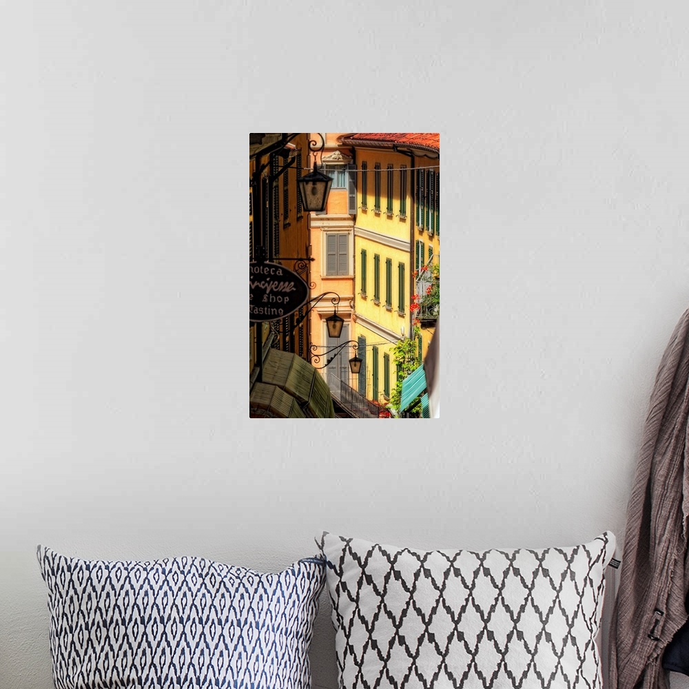 A bohemian room featuring Fine art photo of buildings in an alleyway in an Italian city.
