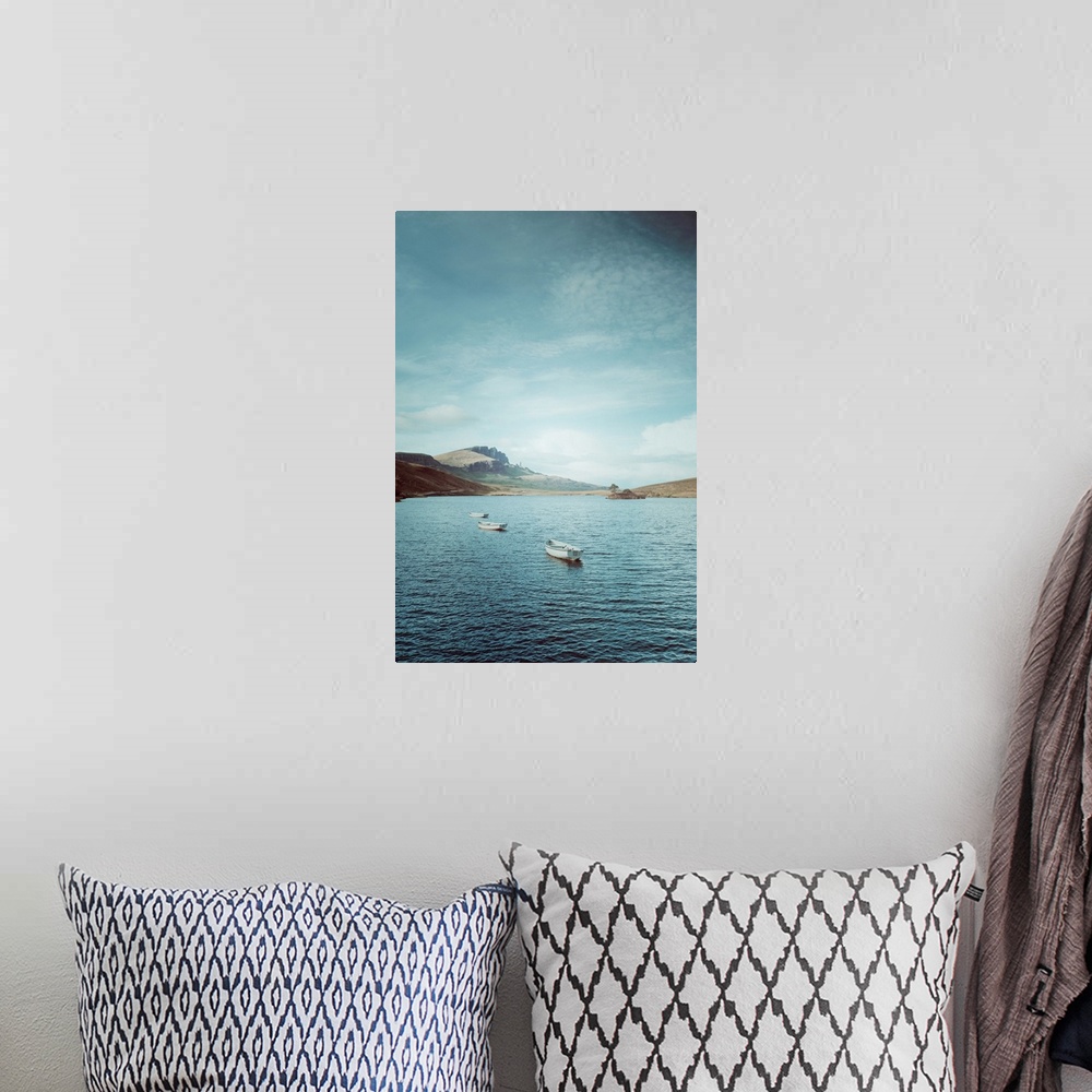 A bohemian room featuring Fine art photo of a few small boats in on the water on a sunny day in Scotland.