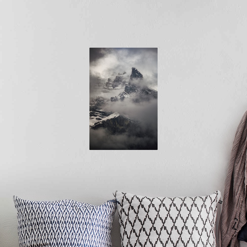 A bohemian room featuring French Alpes, Foggy mountain in snow close up.