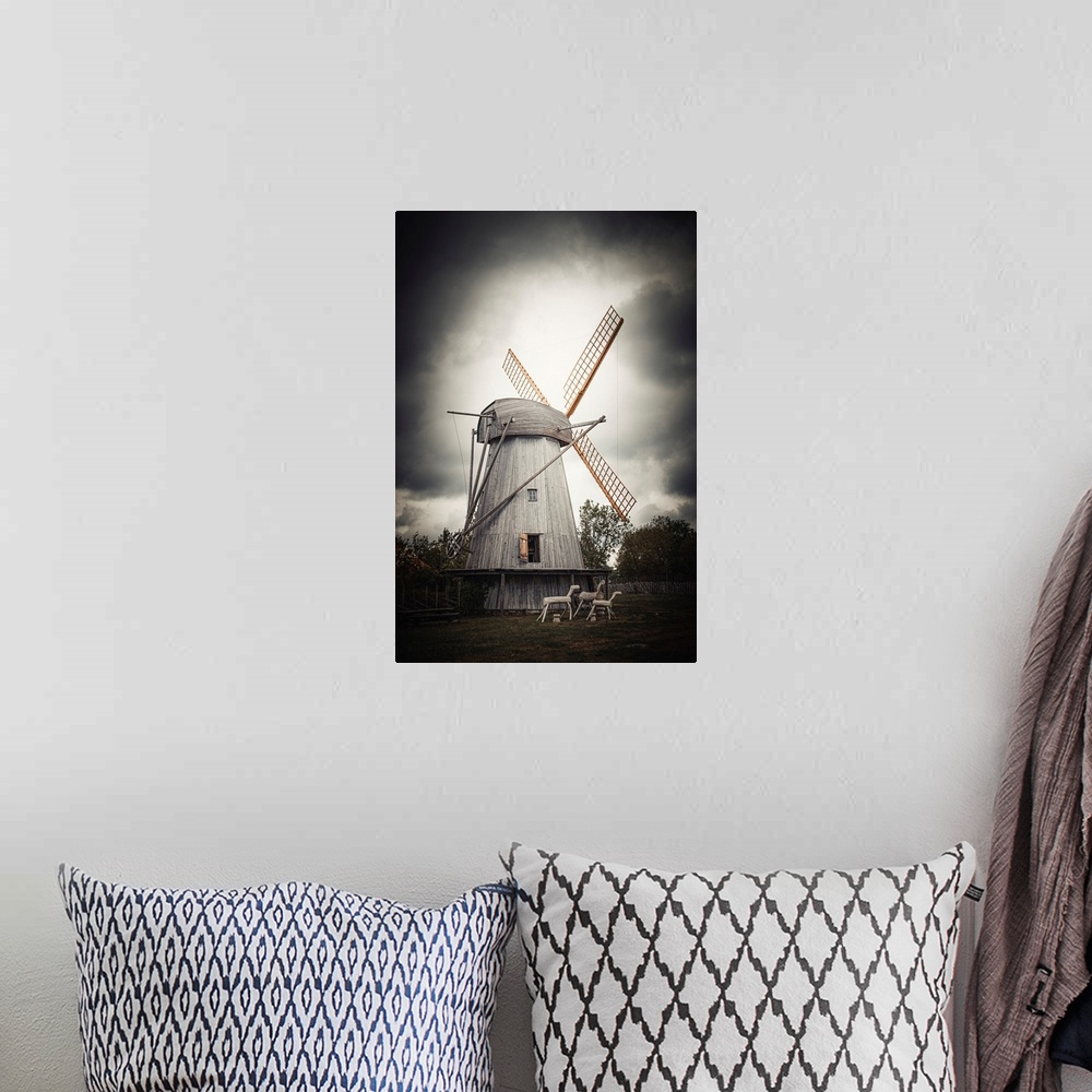 A bohemian room featuring Old windmill close up with stormy sky