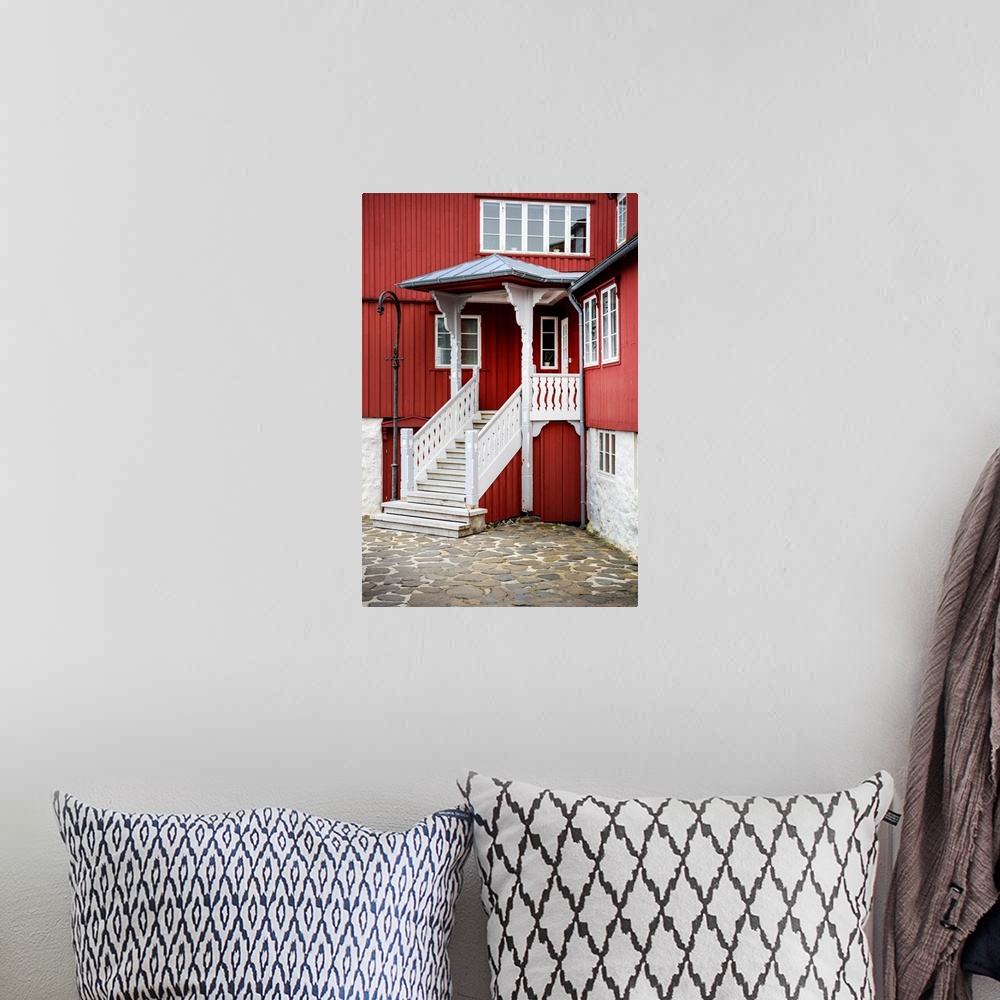 A bohemian room featuring Staircase leading up to the entrance of a red house.