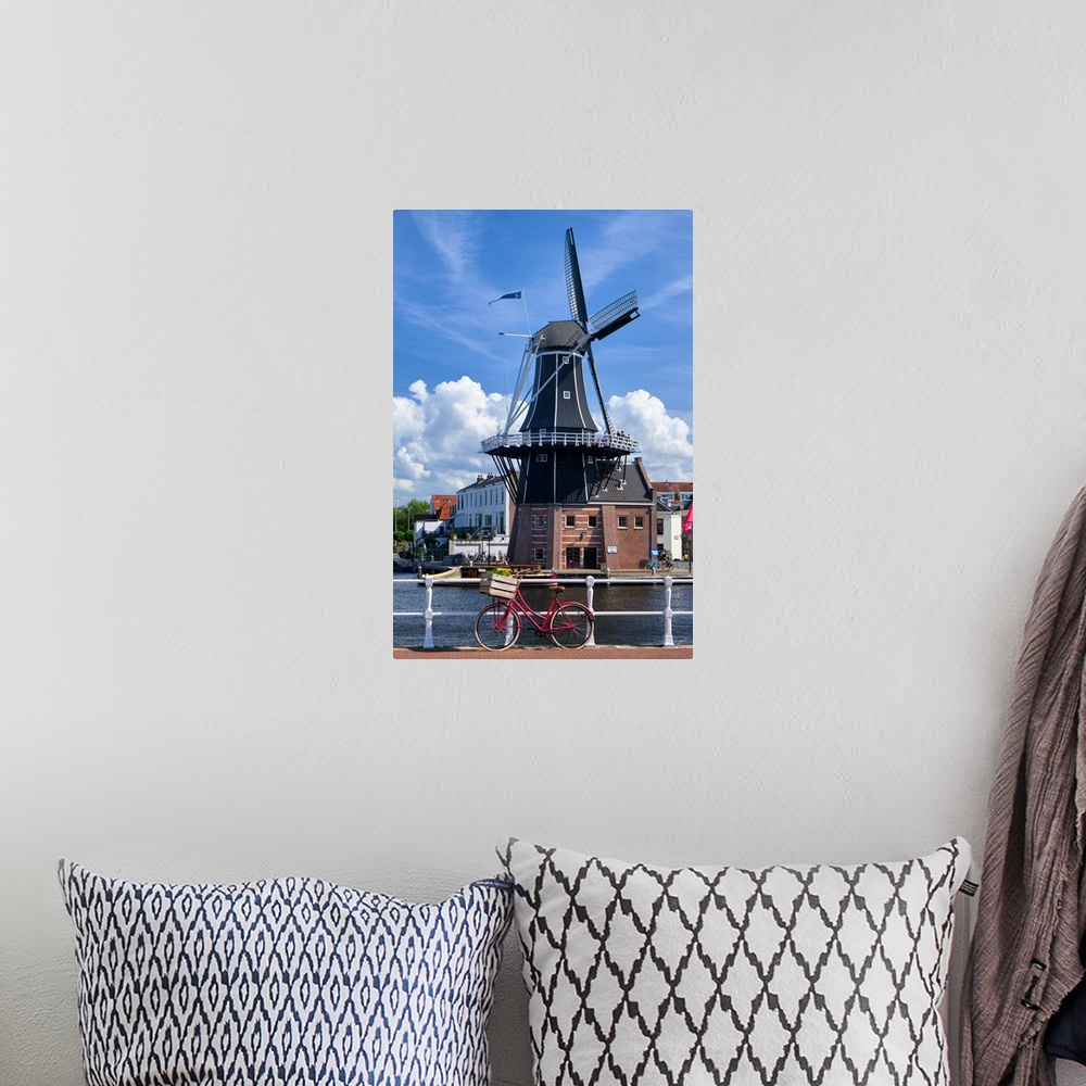 A bohemian room featuring Bicycle on the Bridge with the De Adriaan Wndmill in the Background, Haarlem; The Netherlands