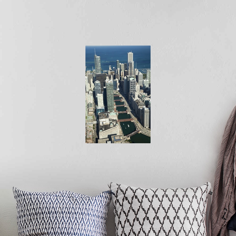 A bohemian room featuring Tall photo print of the Chicago cityscape seen from above with the Chicago River curving through it.