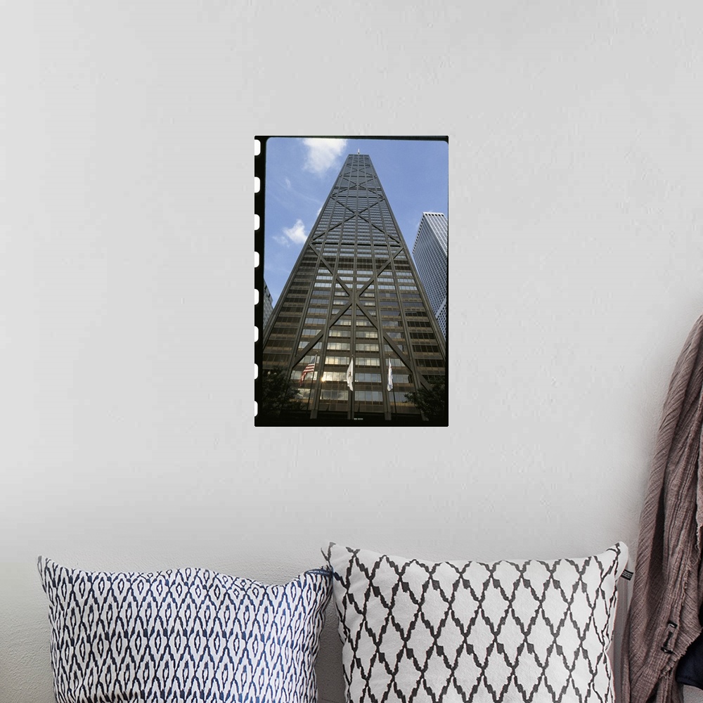 A bohemian room featuring Vertical photograph from below of the Hancock building during the day in Chicago, Illinois.