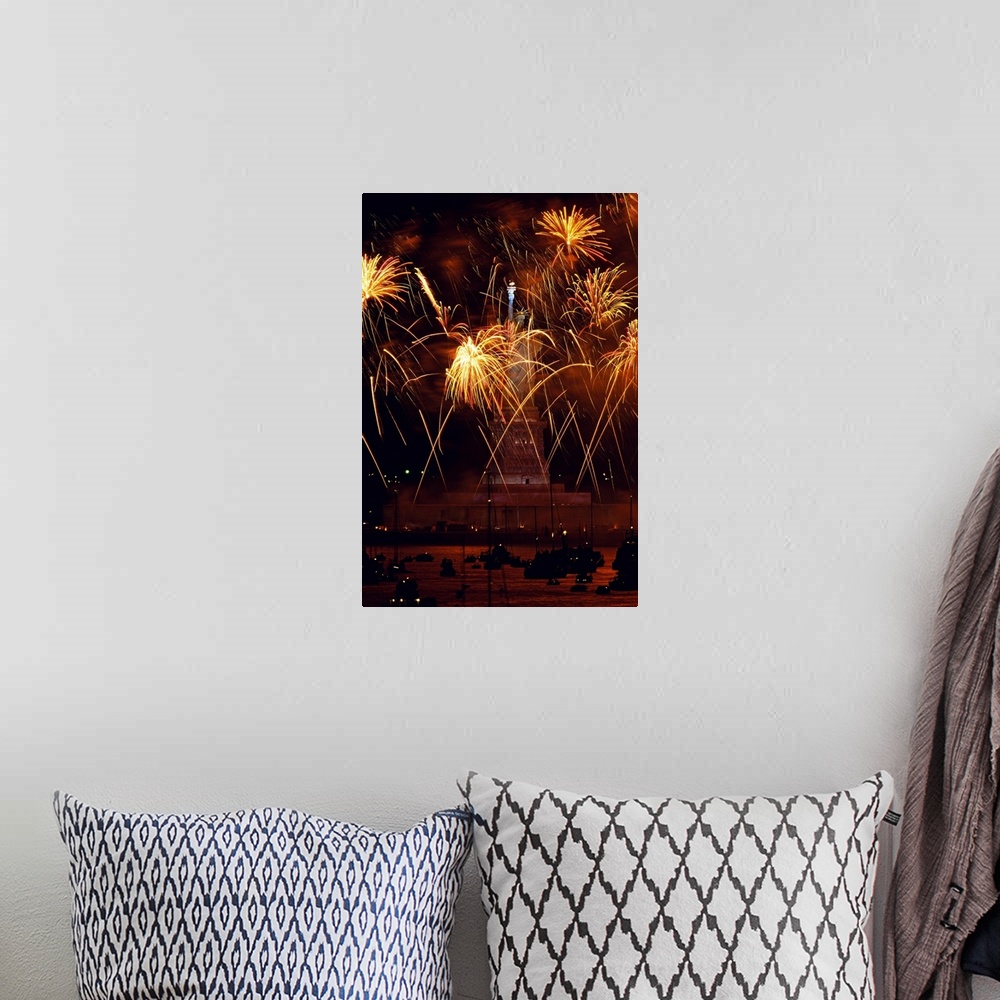 A bohemian room featuring Vertical, oversized photograph of fireworks exploding in front of the Statue of Liberty, as many ...