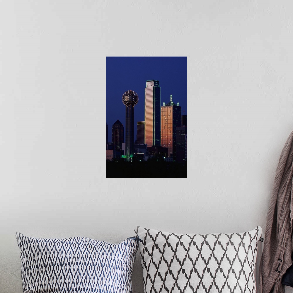 A bohemian room featuring This large vertical piece is a photograph that has been taken of the Dallas skyline with the buil...