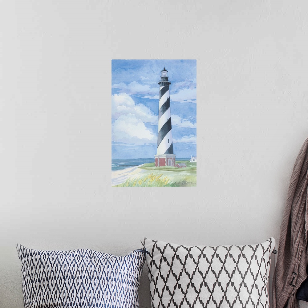 A bohemian room featuring Watercolor painting of the Cape Hatteras lighthouse on the Outer Banks, North Carolina.