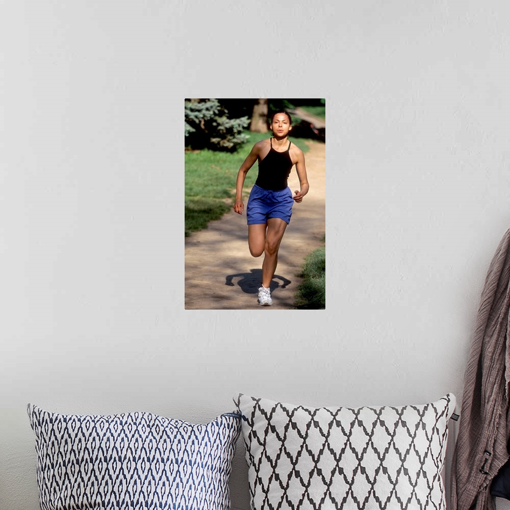 A bohemian room featuring Hispanic woman running for exercise