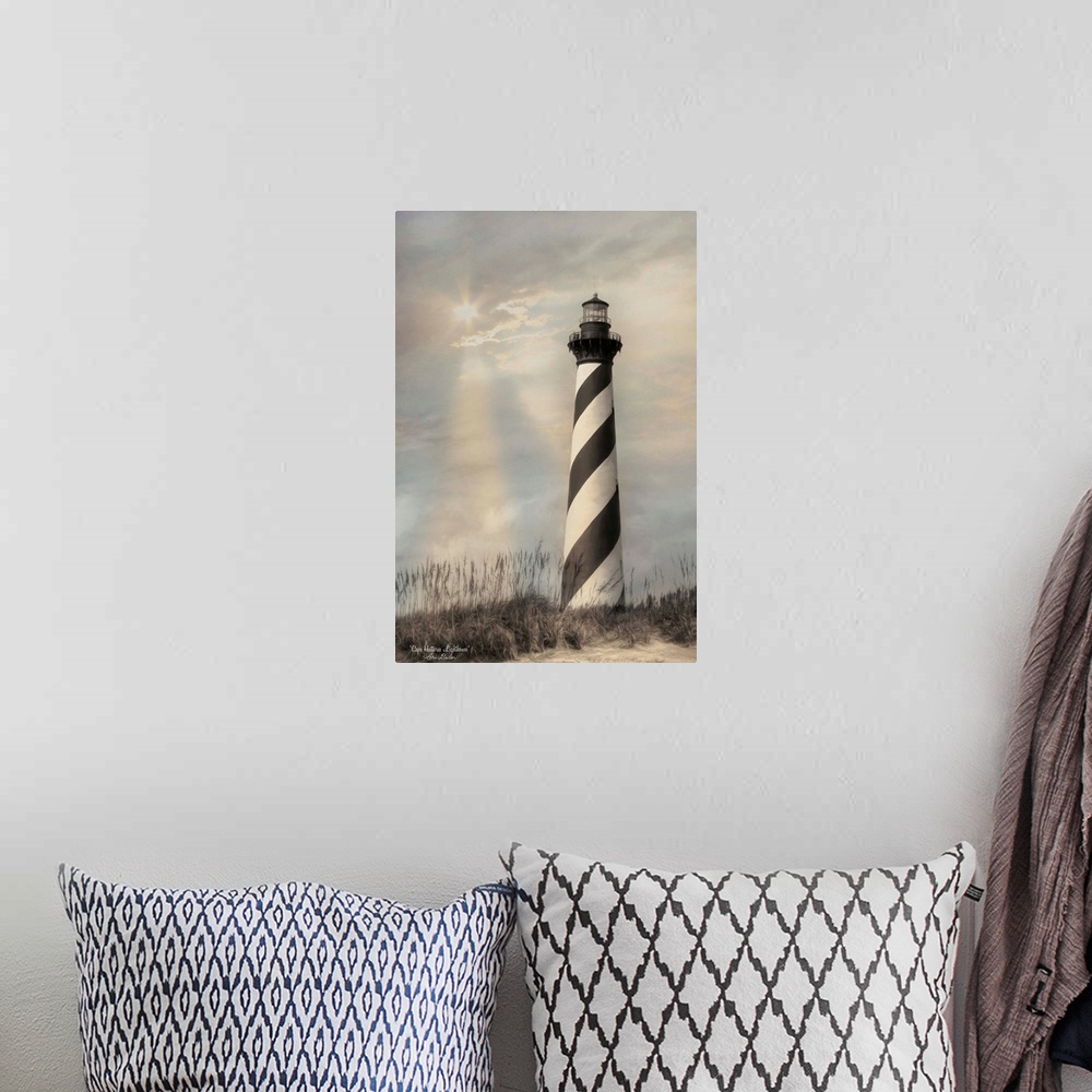 A bohemian room featuring Black and white striped Cape Hatteras lighthouse on the Outer Banks with the sun shining through ...