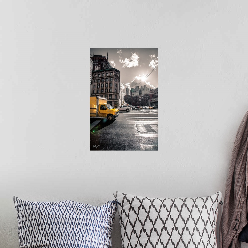 A bohemian room featuring Photograph of a yellow truck popping against a subdued city street scene.