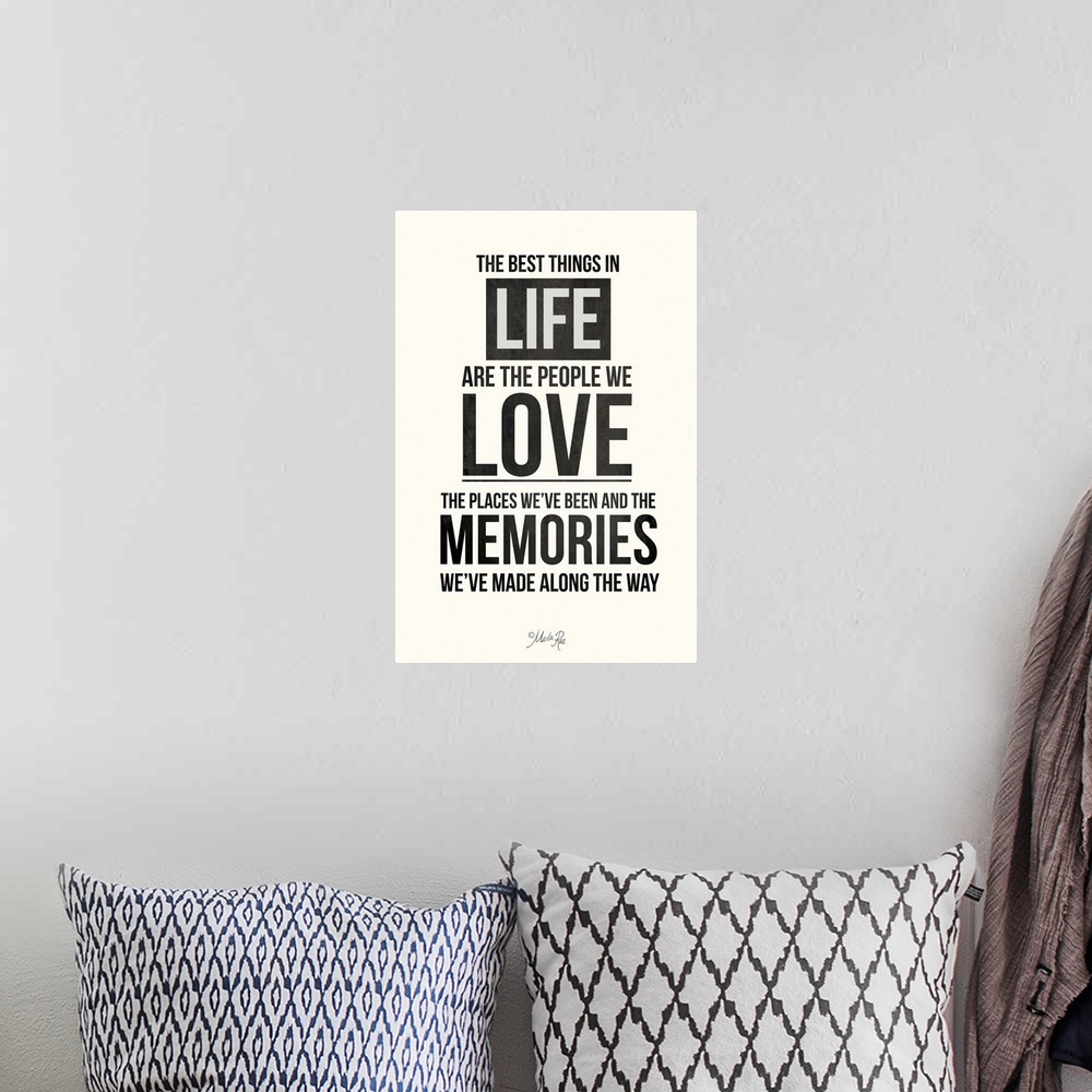 A bohemian room featuring Bold typography design in black and white about love, family, and memories.