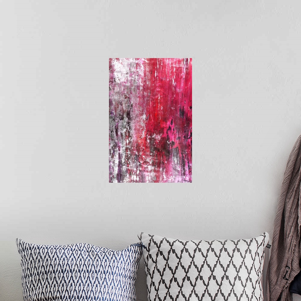 A bohemian room featuring Contemporary abstract painting in vibrant pink and red hues running vertically across the canvas ...