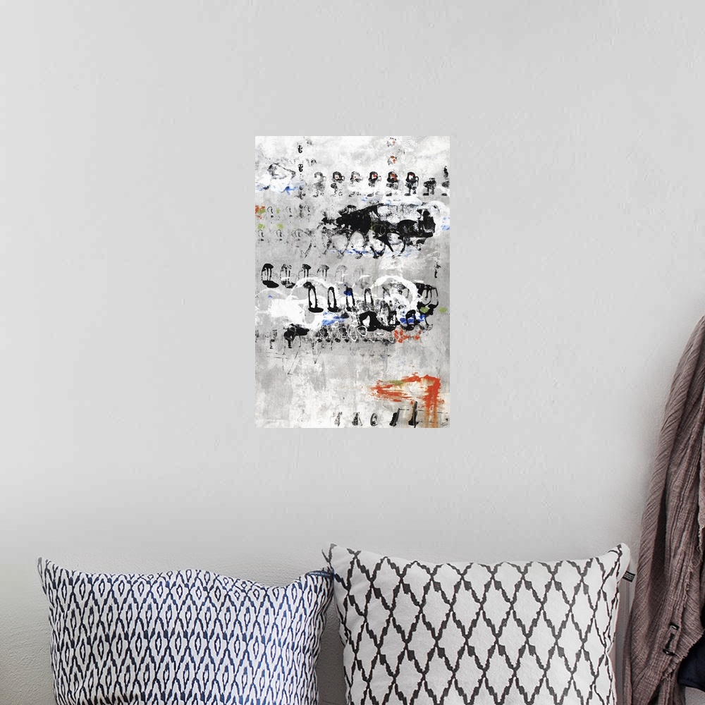 A bohemian room featuring Large abstract painting with a gray and white background and sporadic circular and non-uniform sh...