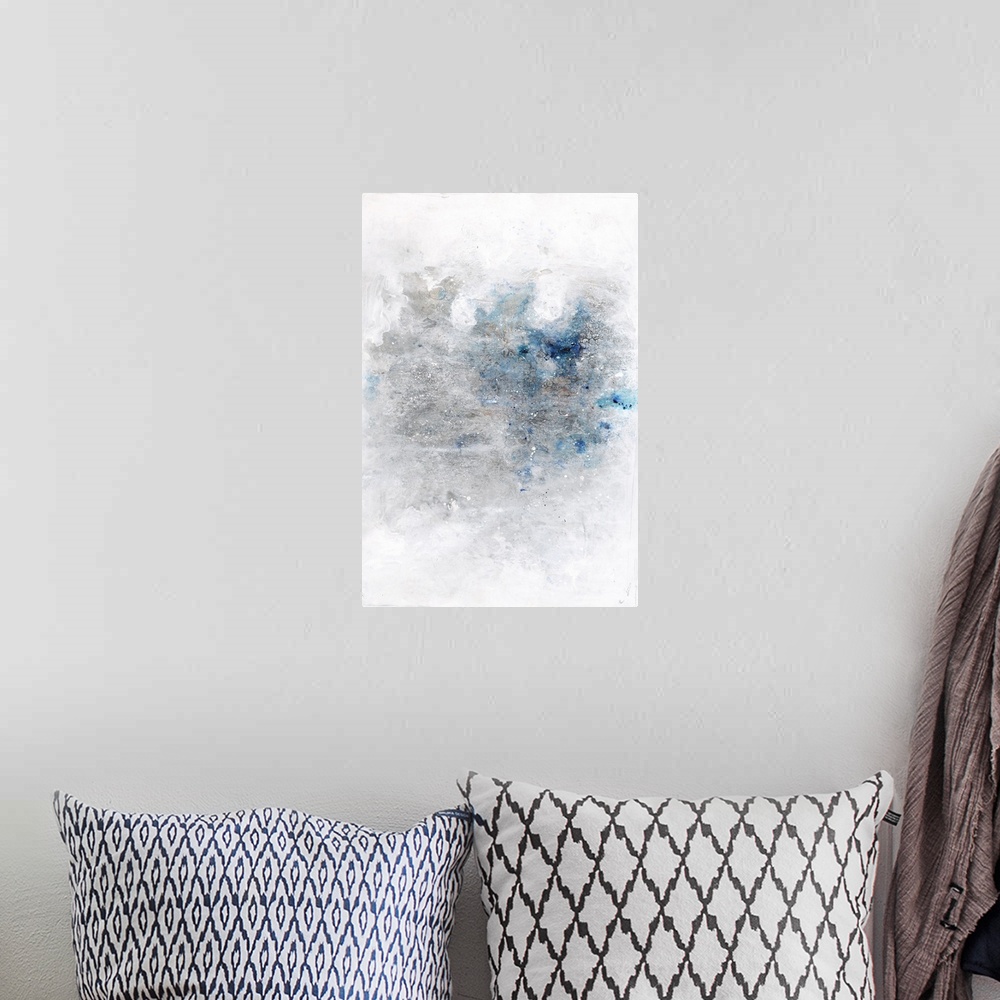 A bohemian room featuring Large contemporary abstract artwork with silver and blue hues in the middle of a white background...