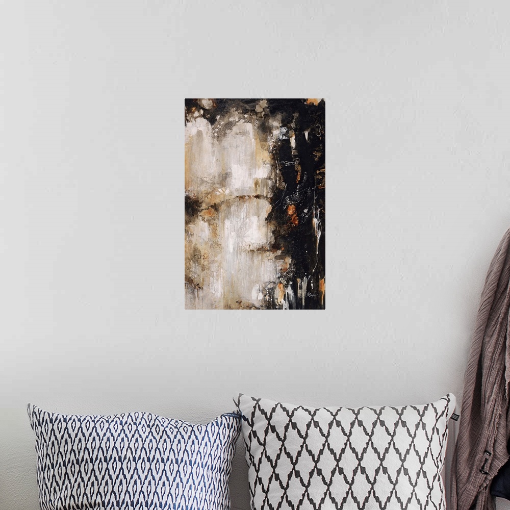 A bohemian room featuring Abstract painting of deep black and rich earth tones clashing toward the center of the image.