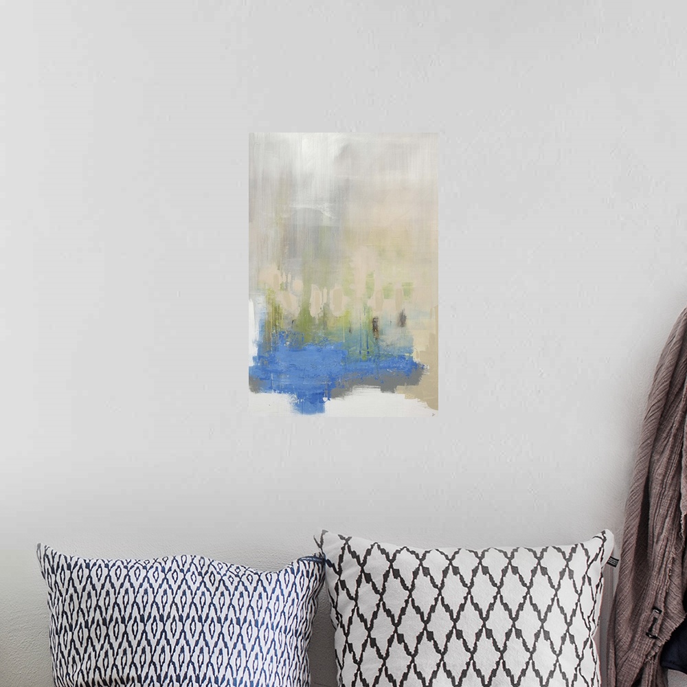 A bohemian room featuring Abstract painting of large blue object that fades into a thick fog above it, with vertical streak...
