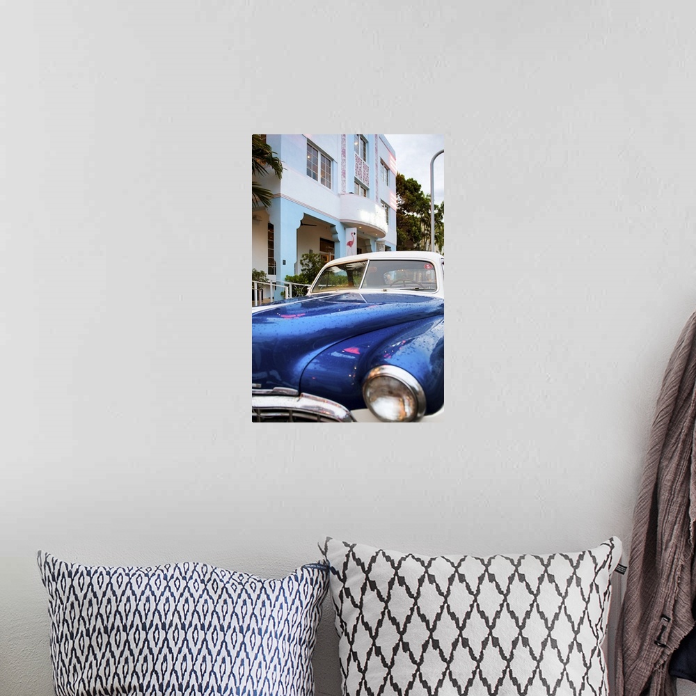 A bohemian room featuring Photograph of a classic car in Miami, Florida, by an art deco style building.