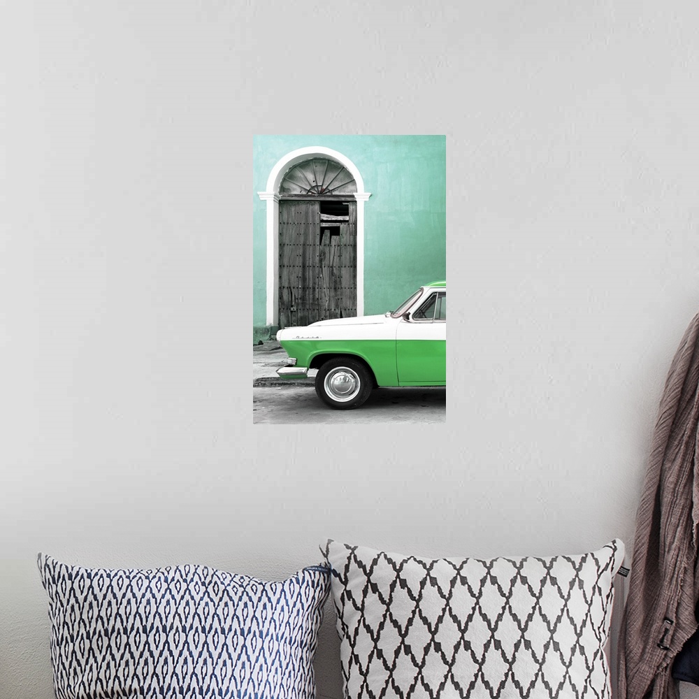 A bohemian room featuring Photograph of the front of a vintage green and white car outside of a green building with a broke...