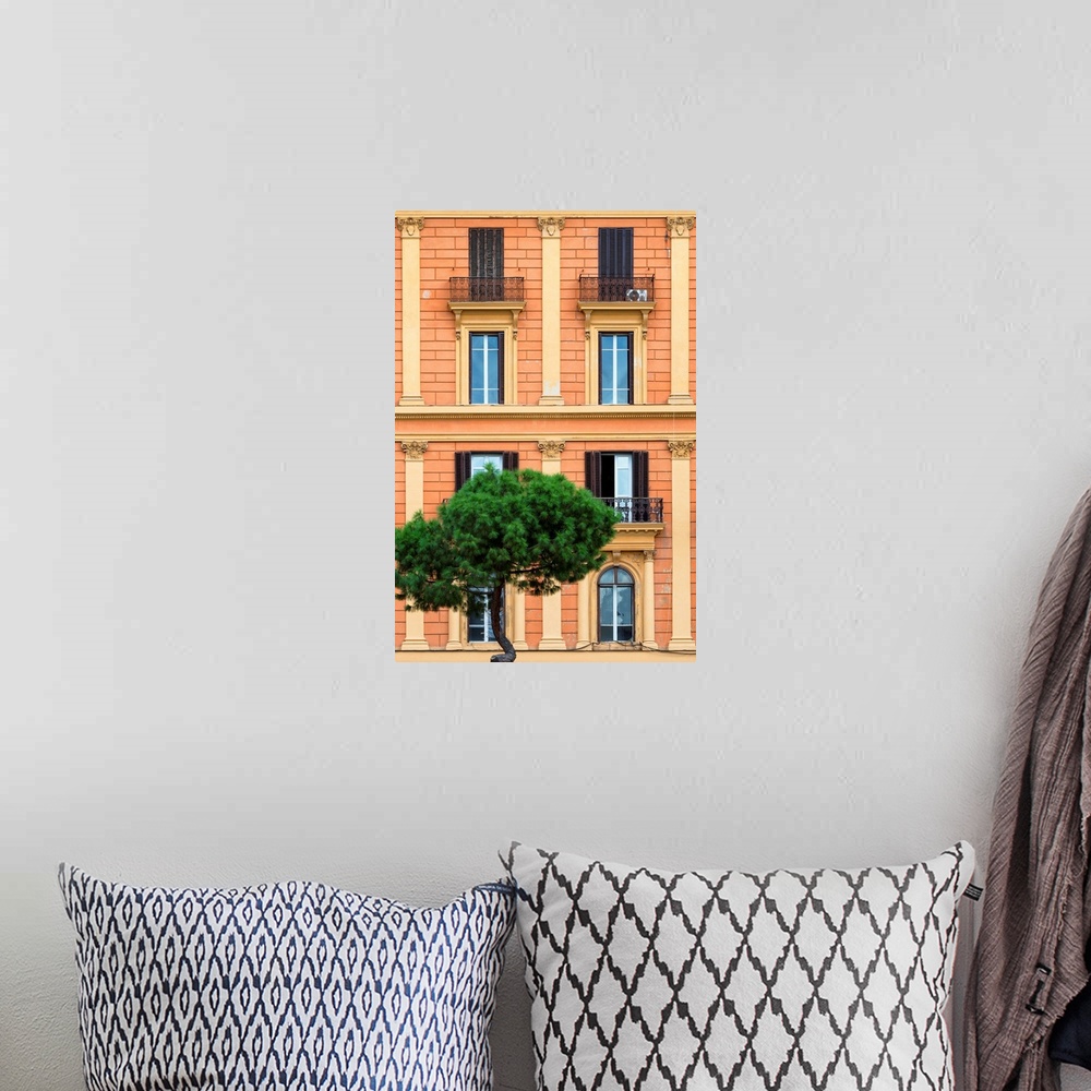 A bohemian room featuring It's a orange facade of a building in the city of Rome in Italy.