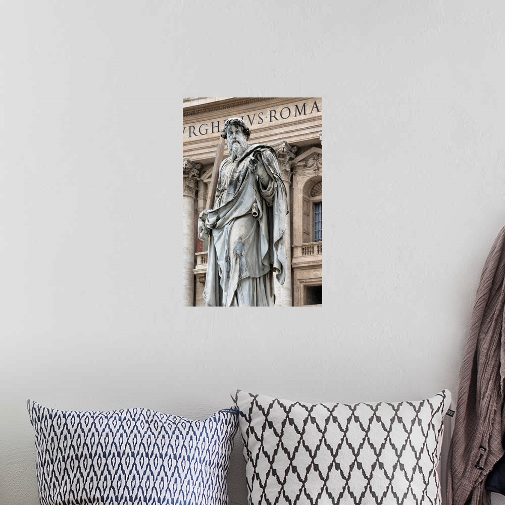 A bohemian room featuring It's a roman sculpture on the exterior of St. Peter's Basilica located in Vatican City.