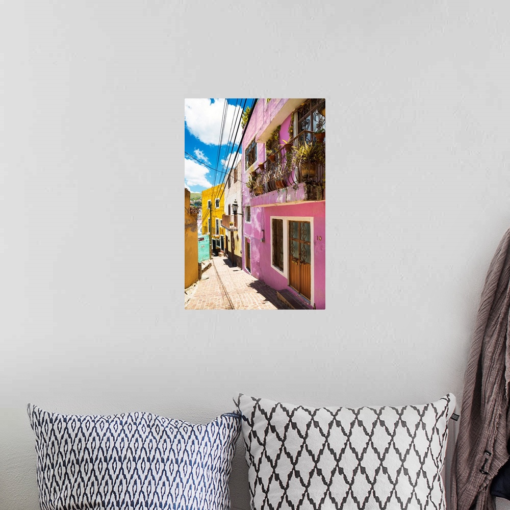 A bohemian room featuring Vertical photograph of a colorful streetscape in Guanajuato. From the Viva Mexico Collection.