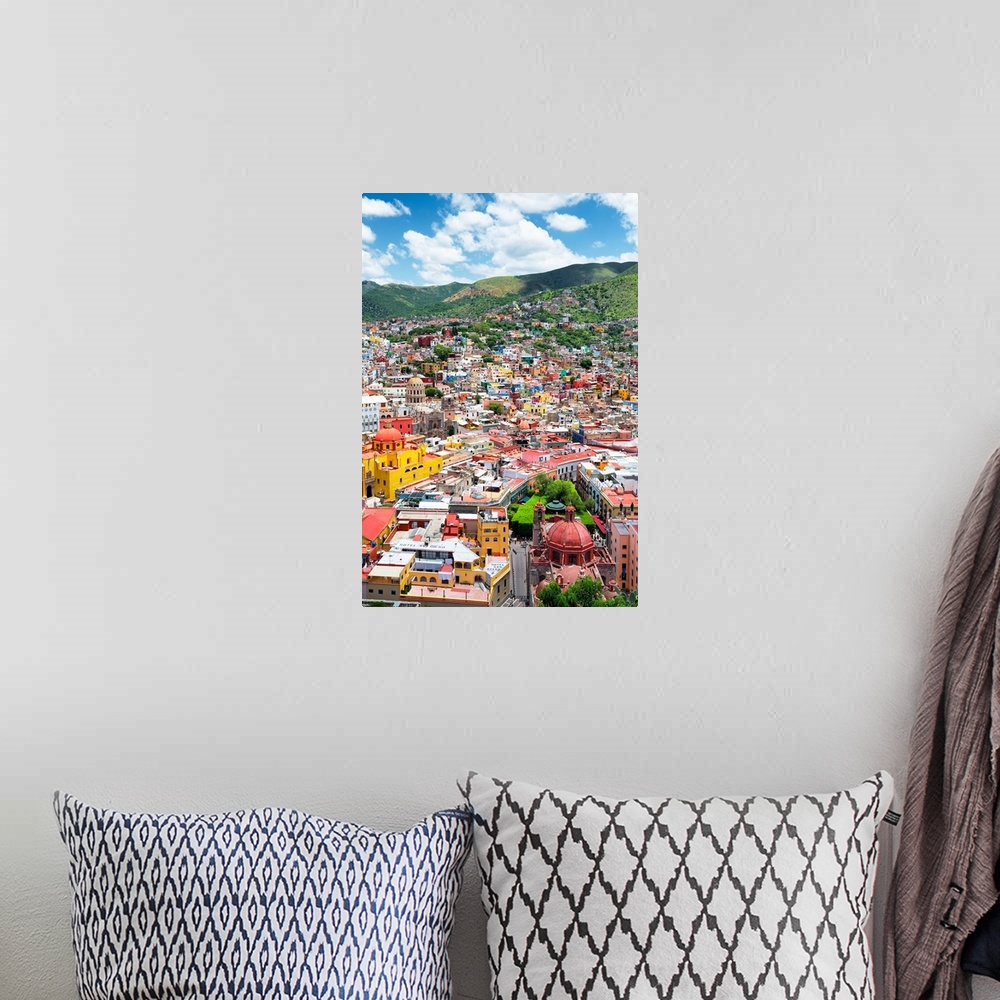 A bohemian room featuring Aerial photograph of the city of Guanajuato, Mexico, with colorful buildings and mountains in the...