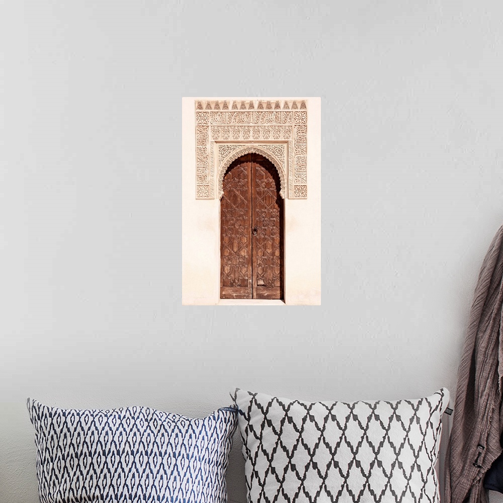 A bohemian room featuring It's a wooden door with arabic designed arch in the Alhambra, Granada, Spain.