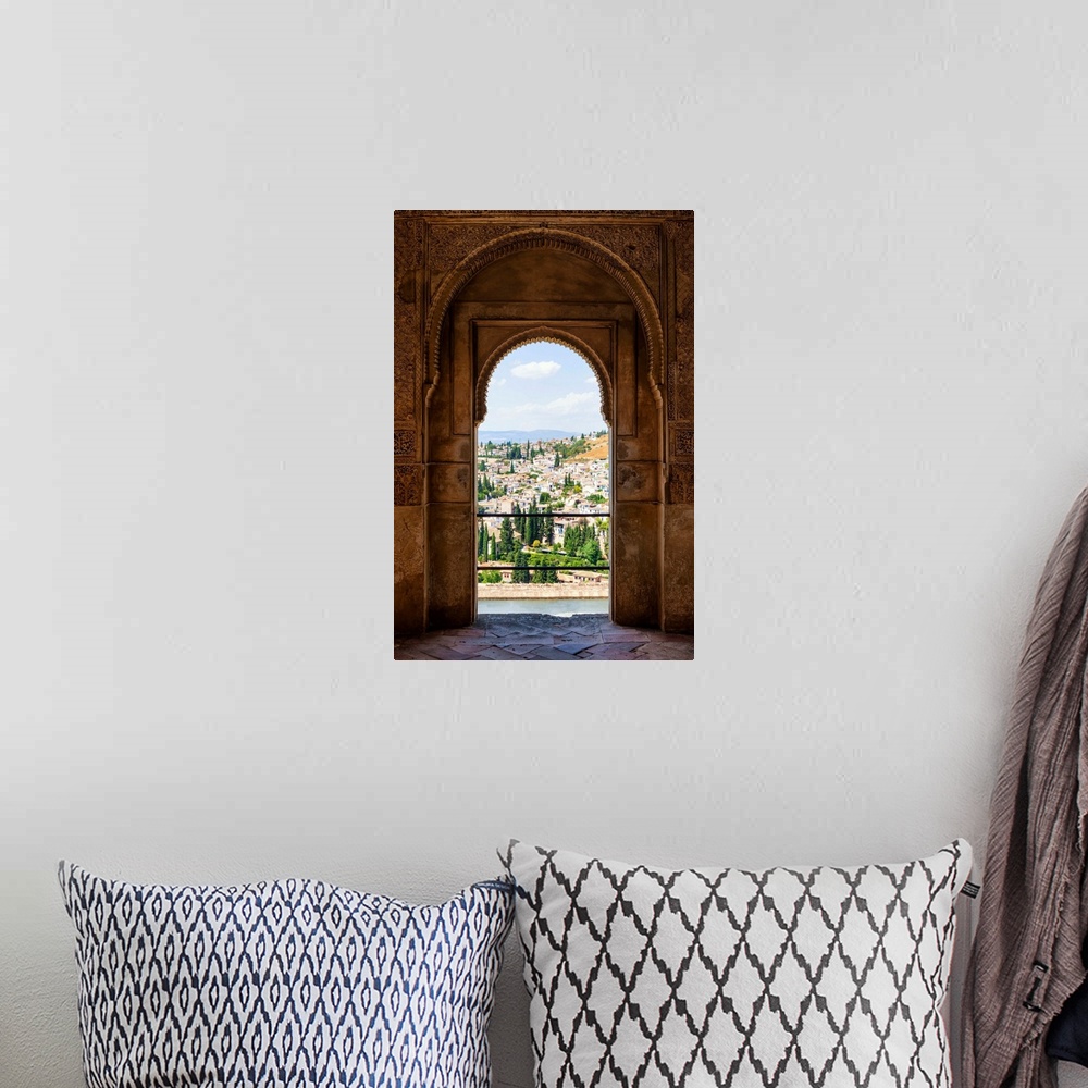 A bohemian room featuring It's a view of the city of Granada by the ancient arches of the Alhambra, Spain.
