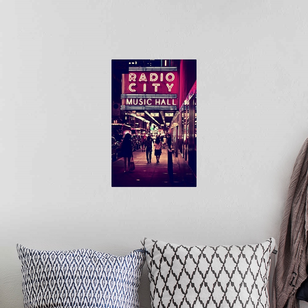 A bohemian room featuring The classic neon sign of Radio City Music Hall in New York City.