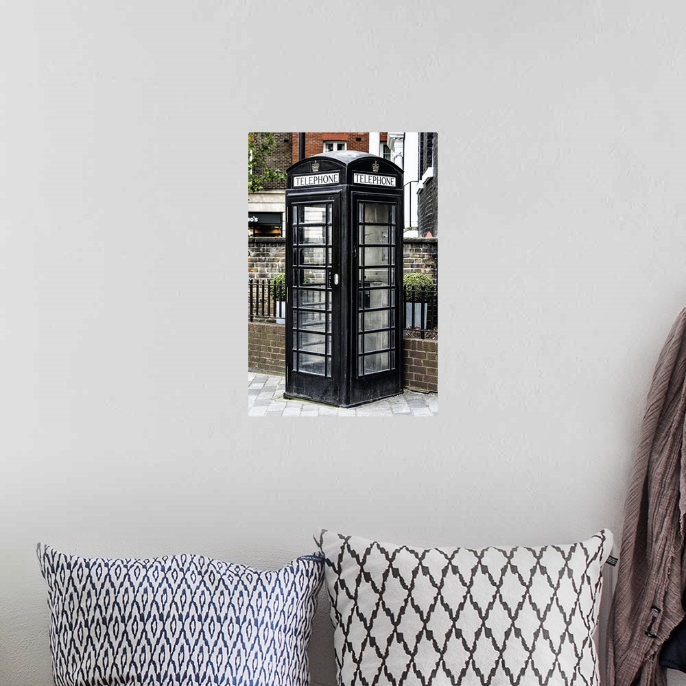 A bohemian room featuring Fine art photo of a London phone booth, unusually painted black.