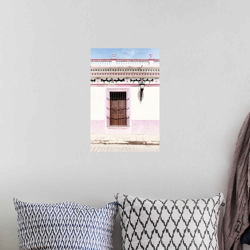 A bohemian room featuring Photograph of a pink and white exterior to a building with detailed designs above the window. Fro...