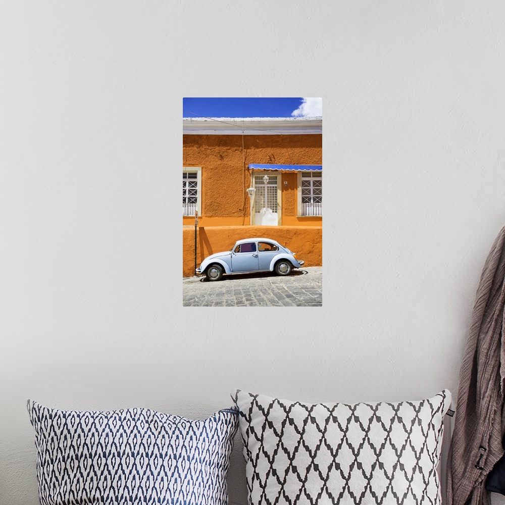 A bohemian room featuring Photograph of a classic Volkswagen Beetle in front of an orange and blue building. From the Viva ...