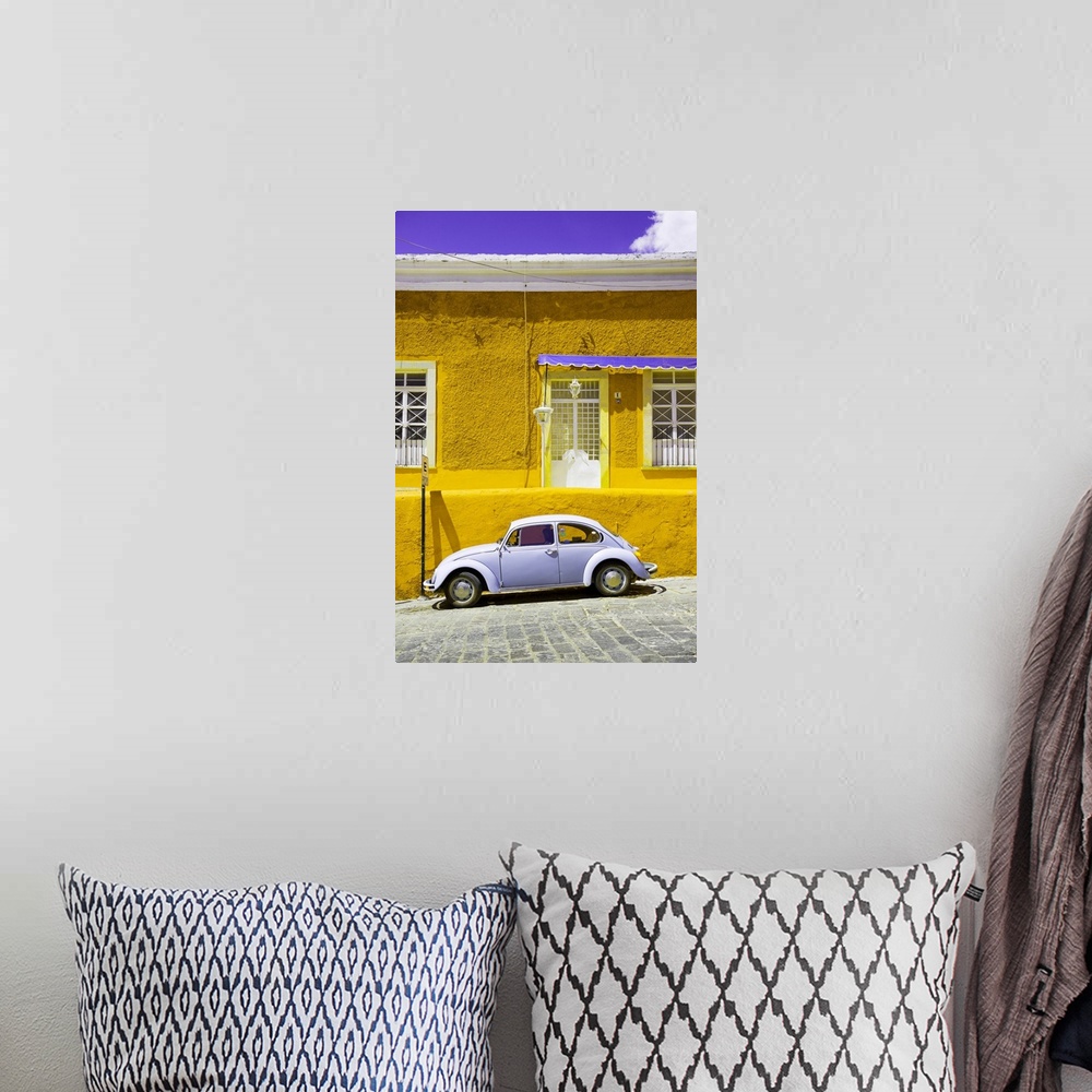 A bohemian room featuring Photograph of a classic Volkswagen Beetle in front of a yellow and purple building. From the Viva...