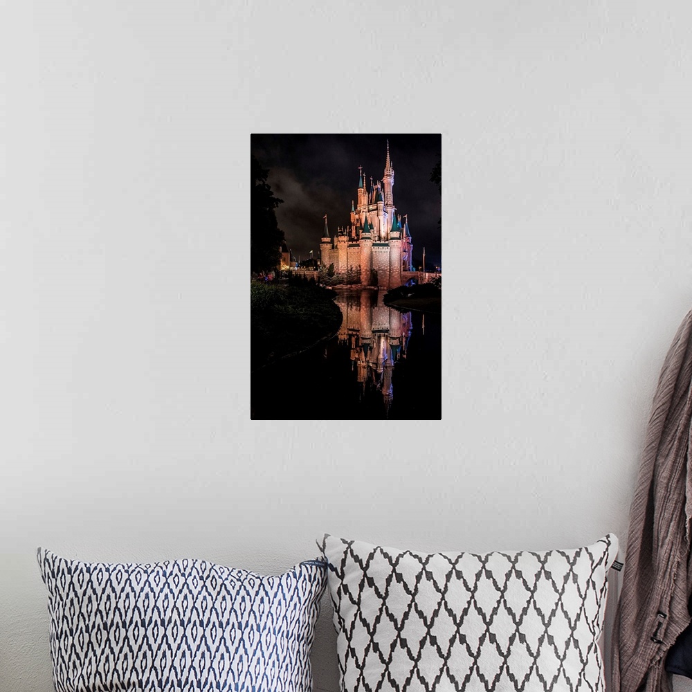 A bohemian room featuring Cinderella's Castle at Walt Disney World in Orlando, Florida, at night.