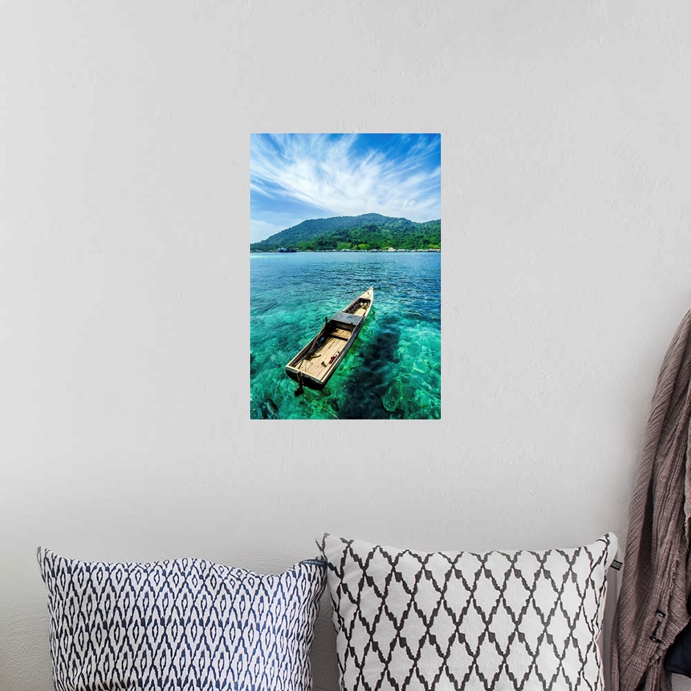 A bohemian room featuring A boat on the clear water near beautiful Letung Island, Indonesia.