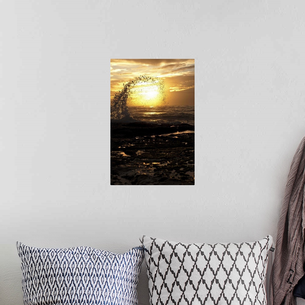 A bohemian room featuring Photograph of a silhouetted wave curling into a circle after splashing up into the air.