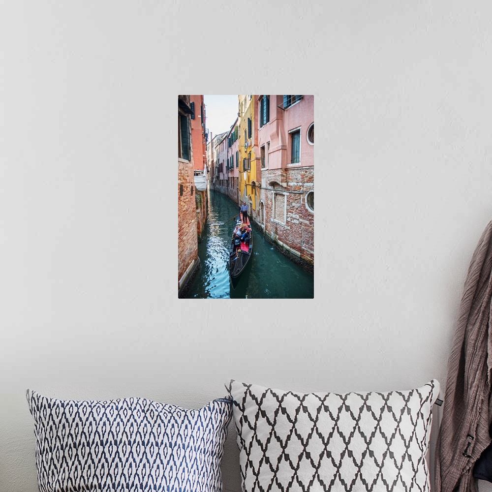 A bohemian room featuring Photograph of a gondola rowing though a canal surrounded by colorful building facades in Venice, ...