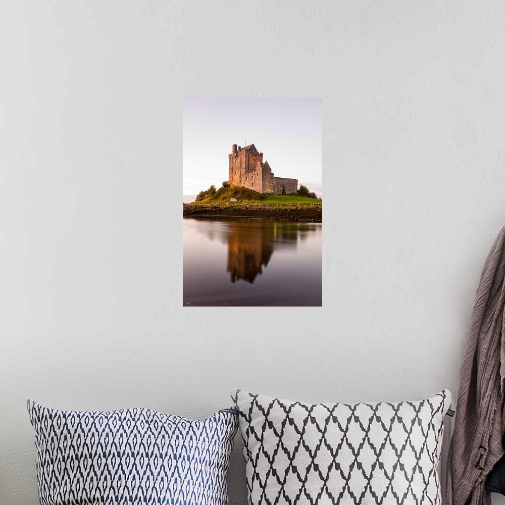 A bohemian room featuring Vertical photograph of the Dunguaire Castle reflecting into the water on the southeastern shore o...