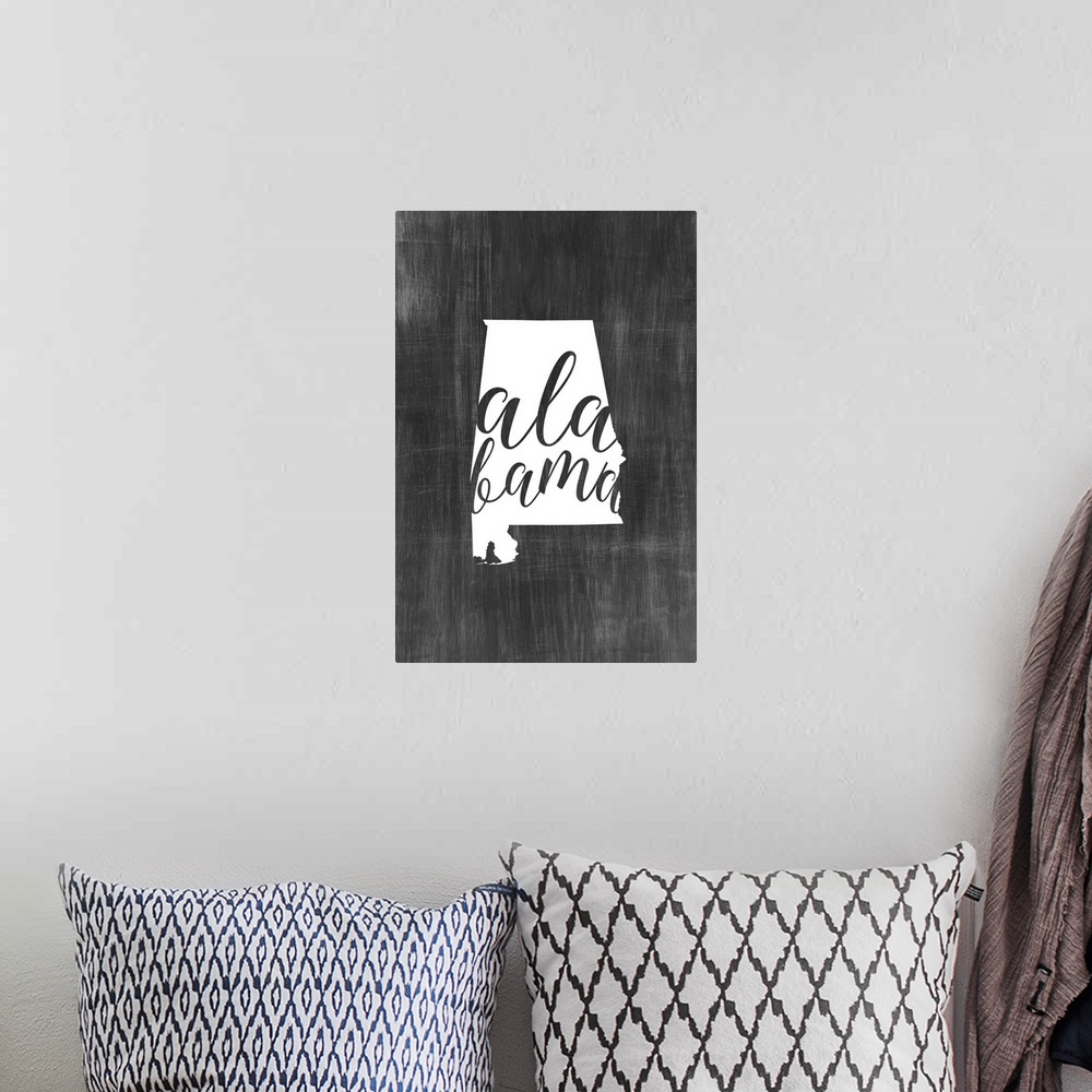 A bohemian room featuring Alabama state outline typography artwork.