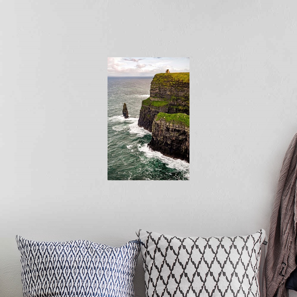 A bohemian room featuring Vertical photograph of O'Brien's Tower, marking the highest point of the Cliffs of Moher in Ireland.