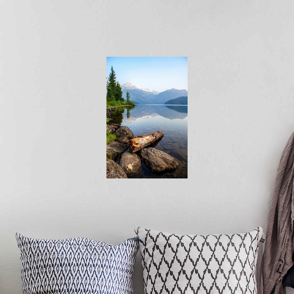 A bohemian room featuring Reflection on Callaghan Lake with Rocks in British Columbia, Canada.