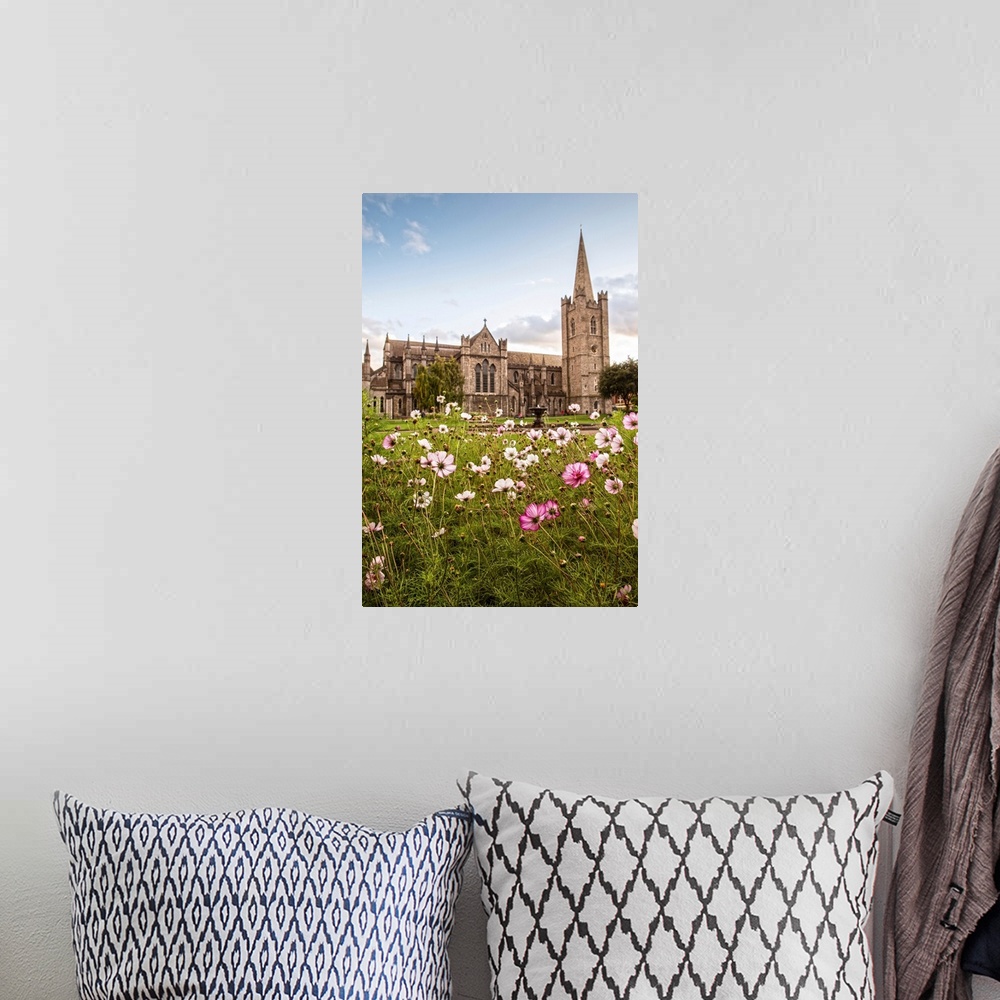 A bohemian room featuring Photograph of St Patrick's Cathedral in Dublin, Ireland, with a field of pink and white wildflowe...