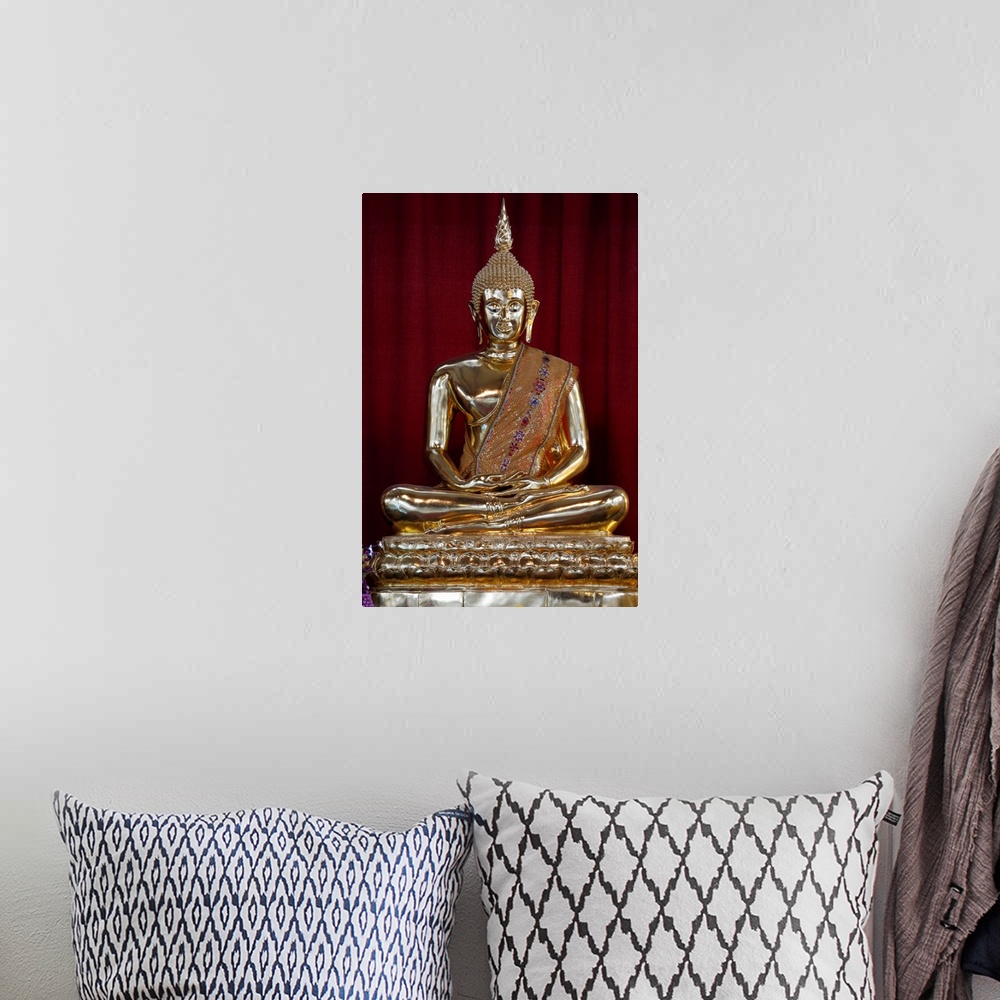 A bohemian room featuring Buddha statue, Wat Velouvanaram, Bussy Saint Georges, Seine et Marne, France, Europe.