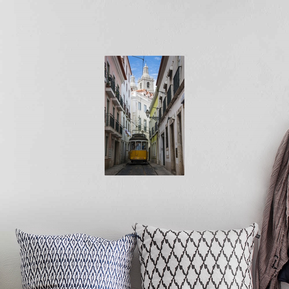 A bohemian room featuring Famous tram 28 going through the old quarter of Alfama, Lisbon, Portugal, Europe.